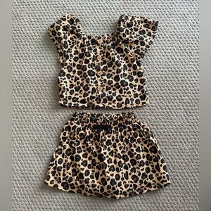 Girls size 4 two piece cheetah set. Skort bottom and top included.